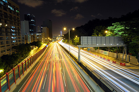 夜间公路踪迹首都场景城市摩天大楼沥青旅行建筑车辆速度图片