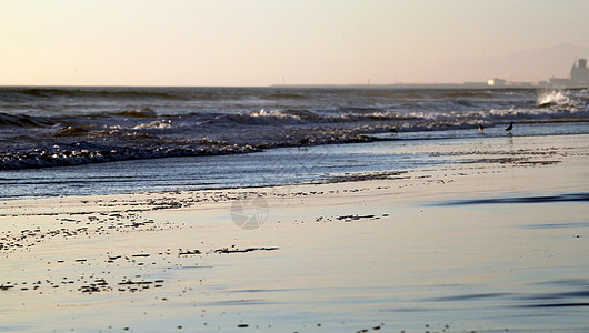 沙滩日落奥尔蒙海滩海洋反射旅行橙子孤独假期辉光冲浪海景阳光图片