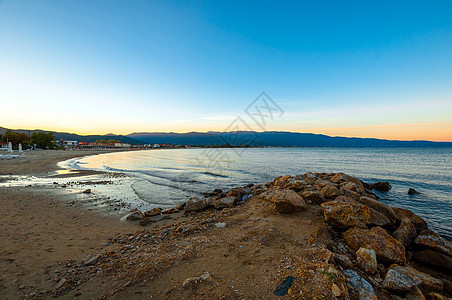 海洋的海岸石头海岸线海滩天空蓝色旅行流动风景海景日落图片