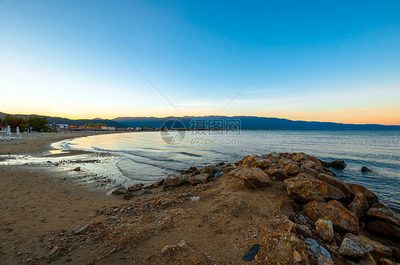 海洋的海岸石头海岸线海滩天空蓝色旅行流动风景海景日落图片