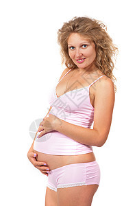 孕妇在抚摸她的肚子女孩微笑女士衣服成人腹部白色身体父母妈妈图片