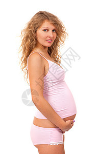 孕妇在抚摸她的肚子父母生活白色微笑情感身体女士女性女孩母亲图片