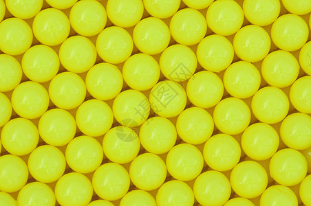 黄黄色塑料背景黄色包装宏观水平墙纸圆形材料爱好按钮纺织品图片