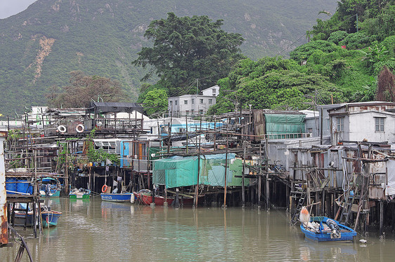 著名的水上木屋村庄窝棚建筑住宅钓鱼场景城市天空旅行蓝色图片