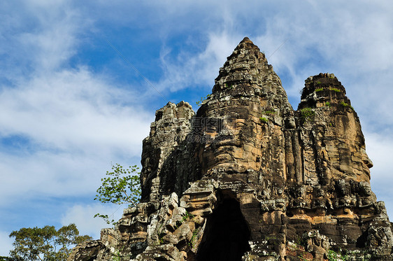 柬埔寨的Bayon寺庙砂岩收获微笑考古学世界热带佛教徒雕塑遗产蓝色图片