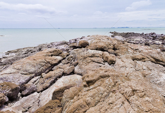 海边的落基海滩海浪岩石太阳风景海景海洋野生动物荒野蓝色天空图片