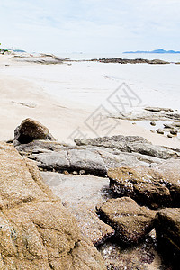 海滩 岩石地区和海洋海岸蓝色正方形海景风景野生动物阳光日出日落荒野图片