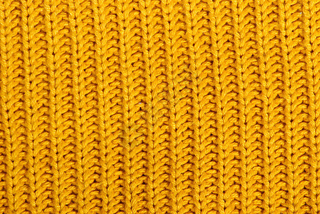 编织结构工艺黄色手工羊毛毛衣背景图片