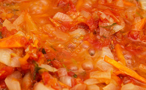 番茄和洋葱炒厨房油炸蔬菜勺子平底锅食物图片