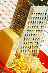 烤奶酪金属烹饪用具桌布盘子厨房奶制品美食品味营养图片