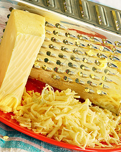 烤奶酪盘子厨房用具奶制品金属桌布品味食物美食黄色图片