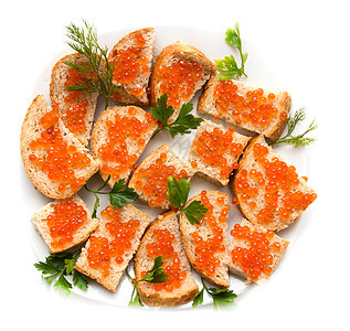 面包上红鱼子酱和卷饼叶子小吃盐渍海鲜食物橙子奶油美食熟食黄油图片