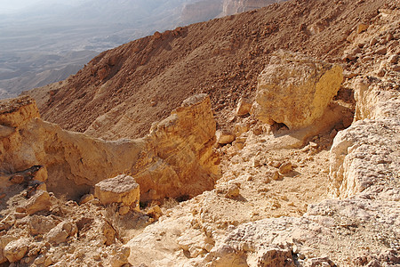 沙漠峡谷(以色列内盖夫沙漠中的或)的采样橙色岩石图片