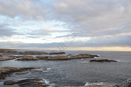 灰石棉保护区岩石灯塔花岗岩日落波浪图片