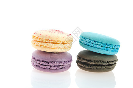 色彩多彩的马卡龙蓝色奶油黑色味道糕点饼干食物甜点糖果白色图片