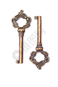 白色背景上的密钥金属房子商业秘密金子骨骼青铜财产古董钥匙图片