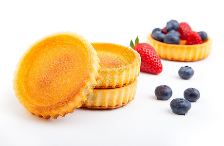 甜甜的蛋糕 有水果 以白叶子隔绝糖果杯子馅饼沙漠奶油面包浆果橙子小吃甜点图片
