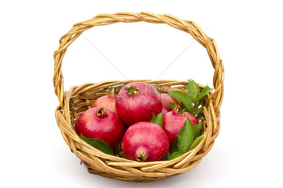 篮子里的新鲜石榴热带白色种子水果红色异国萼片食物营养绿色图片