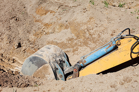 建筑工地的挖掘机拖拉机土壤地面车辆沙坑运动地球装载机黄色机器图片