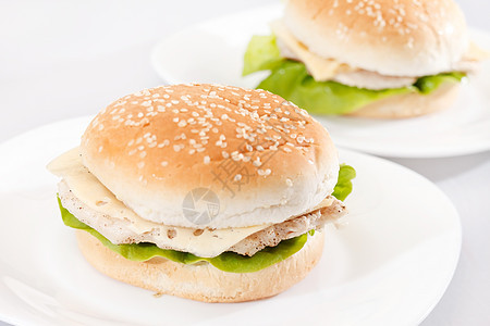鸡肉三明治洋葱包子盘子食物芝麻小吃面包派对图片