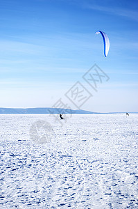 冬季风筝手雕冲浪飞行滑雪速度空气活动蓝色装备动作图片