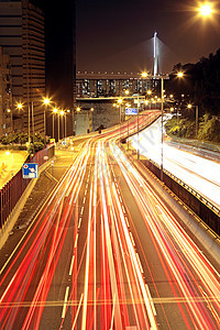 夜间通过市区的交通流量场景运动天空蓝色公共汽车汽车摩天大楼市中心建筑车辆图片