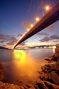 日落时桥地标魔法汽车海洋交通日出石头城市速度小时图片