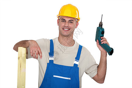 一个有钻孔的男性木匠维修钻头衬衫零售商安全帽帽子修理工工程师电气蓝色图片