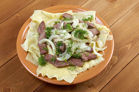 贝什巴马香料羊肉餐厅盘子面条文化牛肉美食用餐洋葱图片