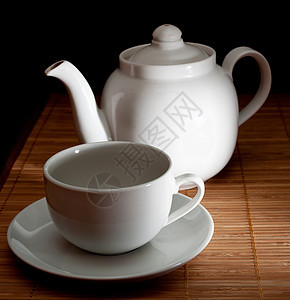 茶和茶壶茶碗盘子制品陶瓷餐具飞碟桌子聚光灯工作室杯子图片