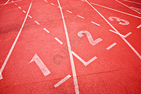 赛道行道红色场地白色体育场太阳竞赛橡皮锦标赛运动跑步图片