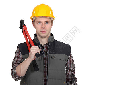 一个有钳子的建筑工人工作建设者安全帽装修男人木匠蓝色建造工程师工具图片