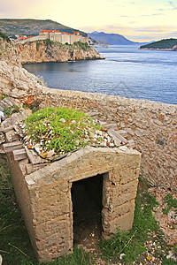 克罗地亚日落时的Dubrovnik老城研究生墙壁建筑学海岸线旅行半岛吸引力城市景观国家图片