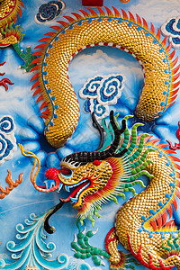 墙上龙的雕像庆典艺术装饰品旅游异国动物信仰旅行寺庙金子图片