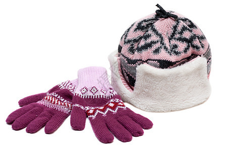 带毛皮和紫色手套的冬帽图片