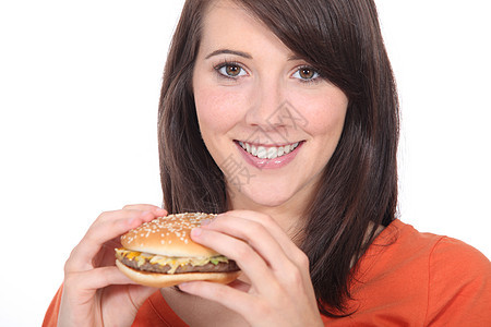 年轻妇女吃汉堡包长发黑发青年芝麻饮食女性面包牛肉女孩海关图片