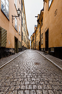 瑞典斯德哥尔摩旧城Gamla Stan窄街中心街道建筑文化石头橙子行人房子市中心历史性图片