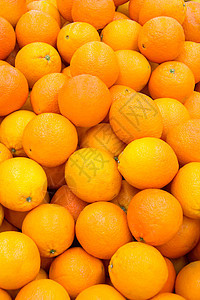 很多新鲜和成熟的橙子团体店铺市场杂货农民商业圆圈倾斜食物农场图片