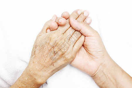 握手牵手医院老年皮肤女性友谊帮助概念护理安慰家庭图片