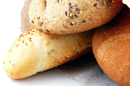 白色背景上孤立的新鲜面包种子金子粮食面包师包子食物早餐谷物小麦面粉图片
