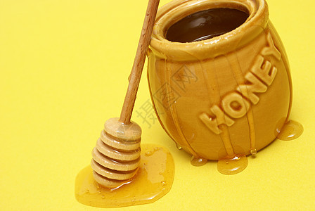 混乱的蜜糖罐金子生产细雨食物流动蜂蜜营养木头毛毛雨跑步图片
