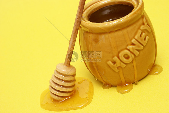 混乱的蜜糖罐金子生产细雨食物流动蜂蜜营养木头毛毛雨跑步图片