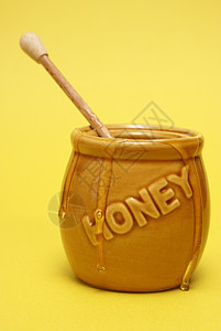 混乱的蜜糖罐蜂蜜营养金子木头食物生产跑步毛毛雨黄色细雨图片