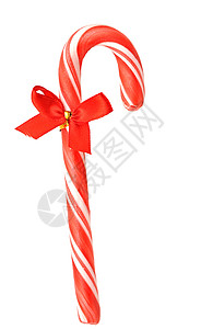 关上圣诞糖果甘蔗丝带条纹红色背景图片