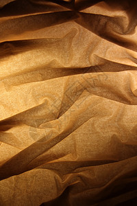 织物背景纺织品发黄隐藏褶皱布料曲线艺术编织宏观折叠图片