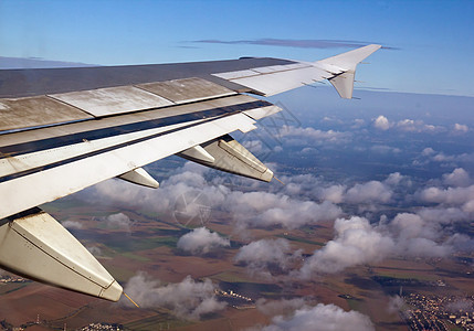 空气中飞行游客翅膀旅游航空天空假期高度土地旅行图片