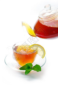茶红色茶壶绿色液体水平叶子棕色一杯茶概念杯子图片