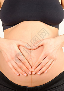 怀着肚子的怀孕妇女胸部衣服女士妈妈弯头母性白色产妇女性身体图片