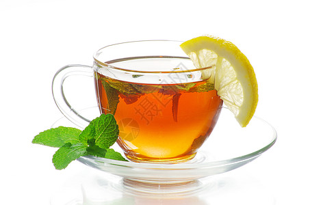 茶一杯茶杯子绿色树叶概念玻璃白色液体柠檬图片