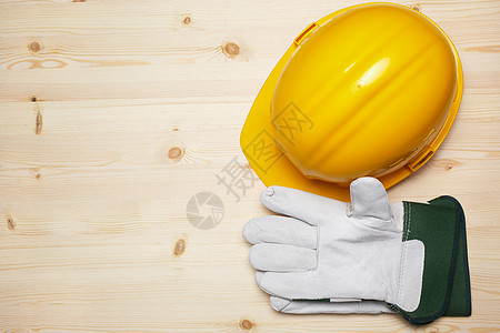 施工背景建筑背景工作安全白色工具木头房子手套头盔塑料黄色背景图片